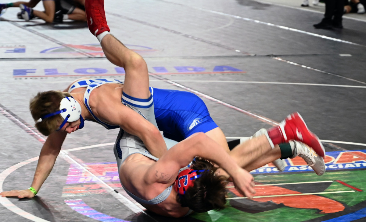 Logan Fowler from Cleveland, Tennessee, takes down Kendrick Hodge from Somerset in a 165-pound semifinal match on Saturday at the Knockout Christmas Classic at Silver Spurs Arena in Kissimmee. 